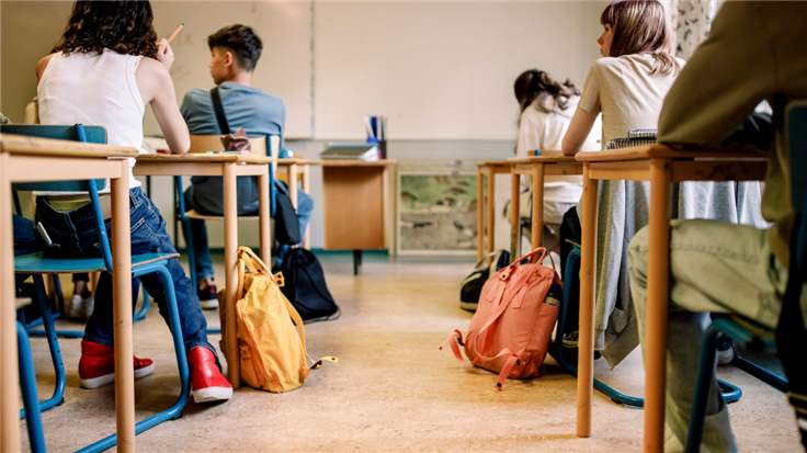 School kids sat at desks