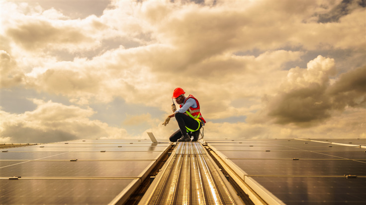 Man on solar panels